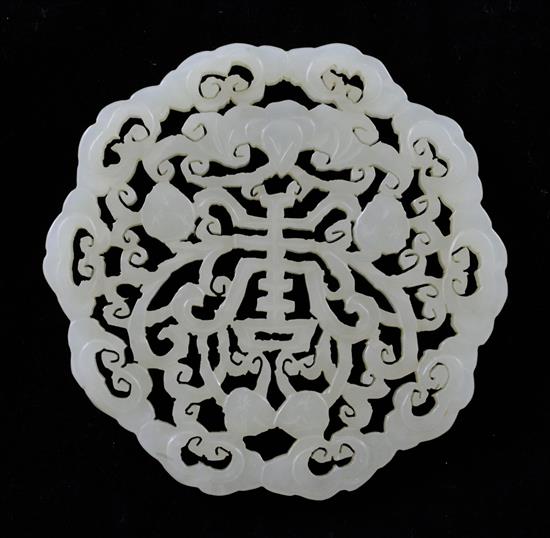 A Chinese pale celadon jade disc, 7.4cm